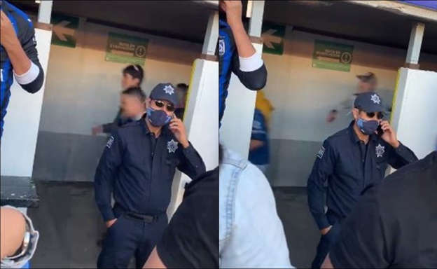 Un policía ignoró la riña en el Querétaro vs Atlas y se puso a hablar por teléfono mientras se presentaban brutales agresiones.